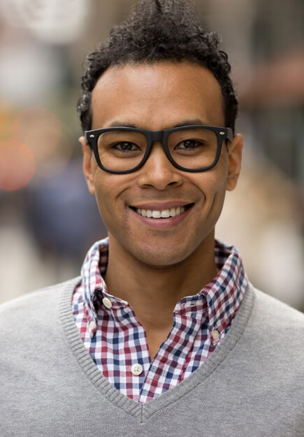 man smiling after dental emergency treatment