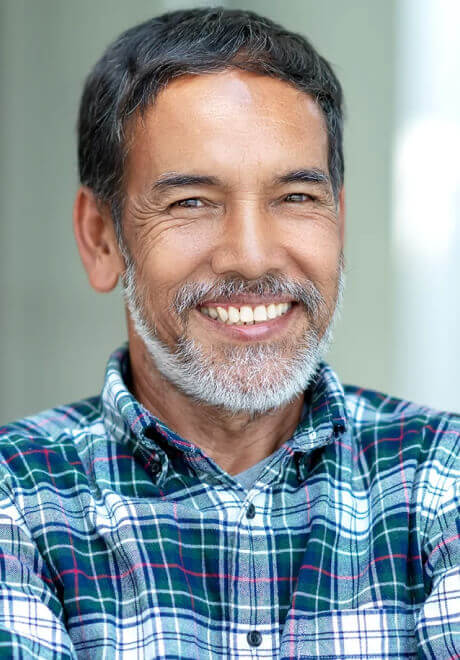 Man smiling confidently after dental implants in Harker Heights